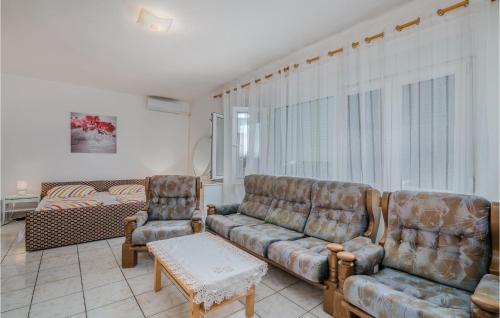 a living room with a couch and two chairs at Nice Apartment In Stara Baska 1 in Stara Baška