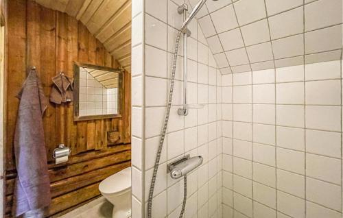 a bathroom with a shower with a toilet in it at 3 Bedroom Awesome Home In Årjäng in Årjäng