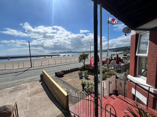 a building with a view of the beach at Stunning 2 Bedroom Sea View Apartment With Parking in Rhos-on-Sea