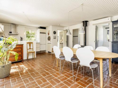 a kitchen and dining room with a table and chairs at 4 star holiday home in Hals-By Traum in Hals