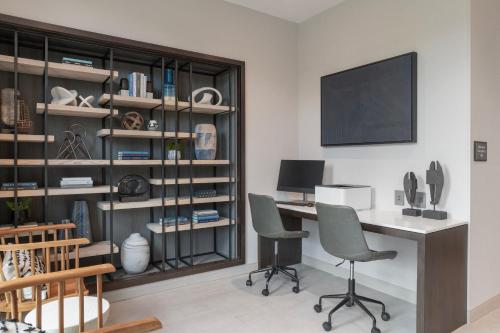 a home office with a desk and two chairs at Fairfield by Marriott Inn & Suites Annapolis in Annapolis