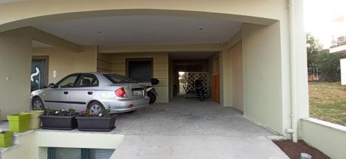a car parked in the garage of a house at AXD Evangelia's apartment in Alexandroupoli