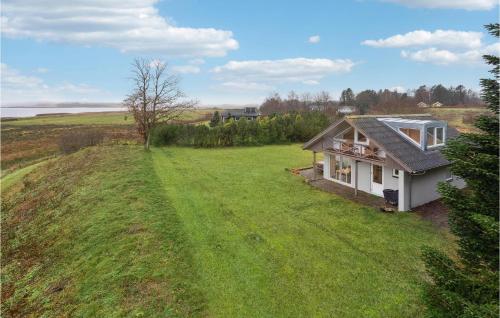 an overhead view of a small house on a grassy hill at 3 Bedroom Amazing Home In Højslev in Højslev