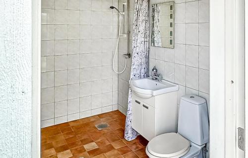 a bathroom with a toilet and a sink and a shower at Lovely Home In Vimmerby With Wifi in Vimmerby