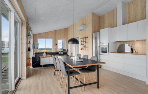a kitchen and dining room with a table and chairs at Beautiful Home In Løgstrup With Kitchen in Løgstrup