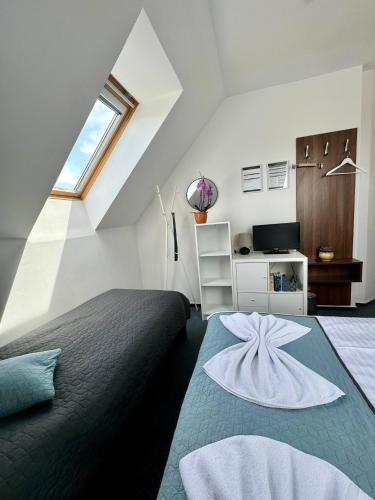 Postel nebo postele na pokoji v ubytování Hotel Vincent