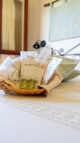 a basket of medicines on a counter in a room at Giardini Malaspina in Bosa