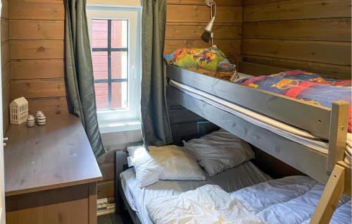 a bedroom with a bunk bed and a window at Beautiful Home In Tingvatn in Tingvatn