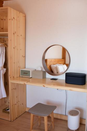 a mirror sitting on a wooden desk in a room at 경주 황리단길 한옥스테이 다가감 in Gyeongju