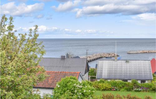a view of the ocean from a house at Stunning Home In Simrishamn With Wifi in Simrishamn
