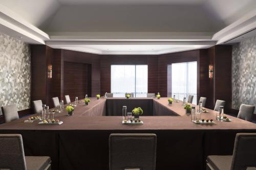 a large meeting room with a large table and chairs at The Ritz-Carlton, Denver in Denver