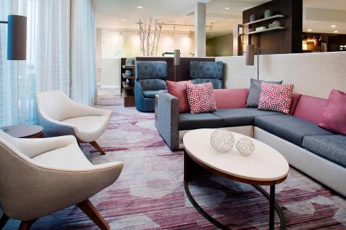 a living room with a couch and chairs at Courtyard by Marriott Birmingham Homewood in Birmingham