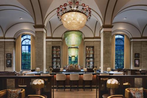 a large room with chairs and a chandelier at Hotel Cleveland Autograph Collection in Cleveland