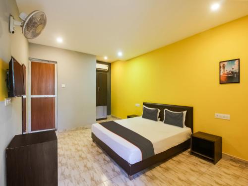 Ένα ή περισσότερα κρεβάτια σε δωμάτιο στο Hotel O MAP INN