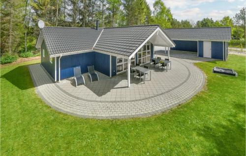 an overhead view of a house with a patio at Holiday Home Hybenvangen Oksbøl Denm in Oksbøl