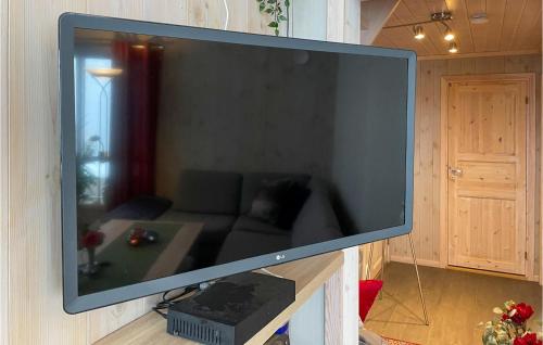 a large flat screen tv hanging on a wall at 3 Bedroom Stunning Home In Aurdal in Aurdal