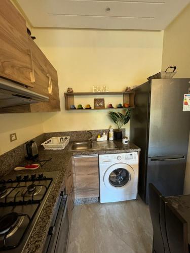 Kuchyň nebo kuchyňský kout v ubytování CASA BAY BEACH OMK 2