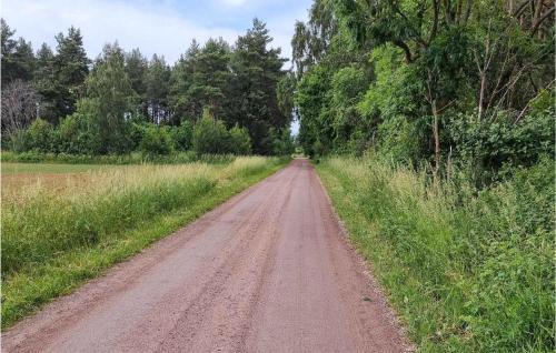 a dirt road in the middle of a field at 5 Bedroom Nice Home In Borgholm in Borgholm