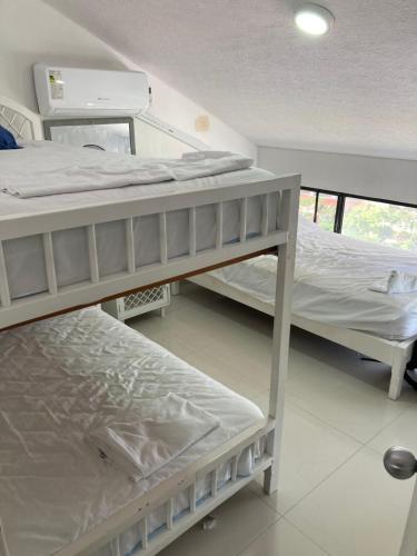 Llit o llits en una habitació de Duplex PH 8 pers Tonsupa Playa Almendro