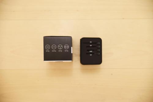 a remote control sitting on top of a wooden table at Shonai Hotel Suiden Terrasse in Tsuruoka