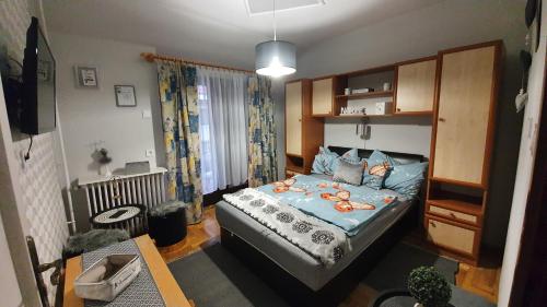 Postel nebo postele na pokoji v ubytování Ágnes Vendégházak Siófok-apartman 2