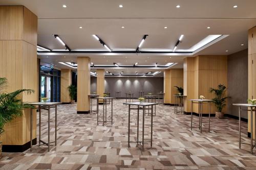 an image of a lobby with tables and stools at Sheraton Fiji Golf & Beach Resort in Denarau