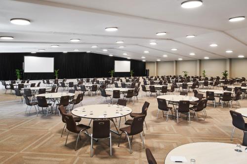 a large room with tables and chairs in it at Sheraton Fiji Golf & Beach Resort in Denarau