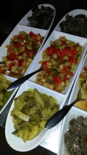 a group of plates of food on a table at Agriturismo Valle Isola "La Tana del Gusto" in Comacchio