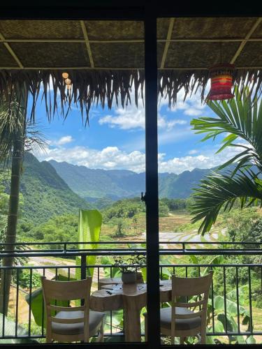 a view from a restaurant with a table and chairs at Puluong Aroma in Hương Bá Thước