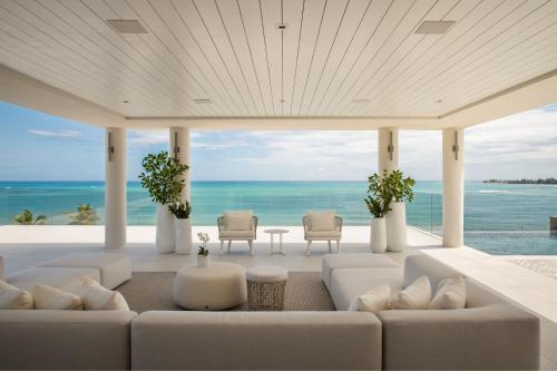 a living room with a view of the ocean at St. Regis Bahia Beach Resort, Puerto Rico in Rio Grande