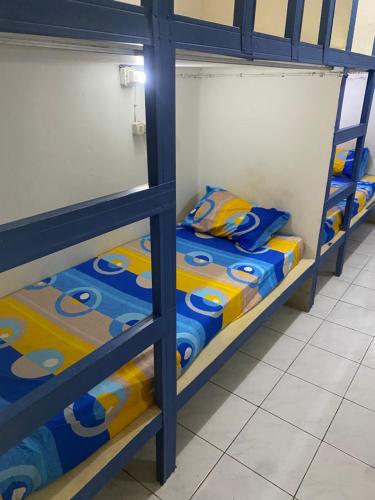 Postel nebo postele na pokoji v ubytování Cempaka hostel