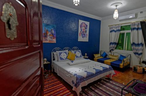Postel nebo postele na pokoji v ubytování Riad Parfums de OUARZAZATE