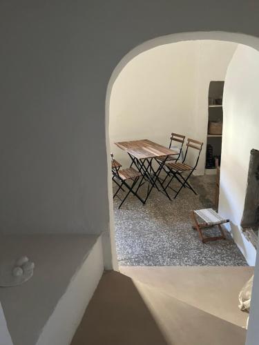a view of a table and chairs in a room at L’Edicola Votiva in Casarano