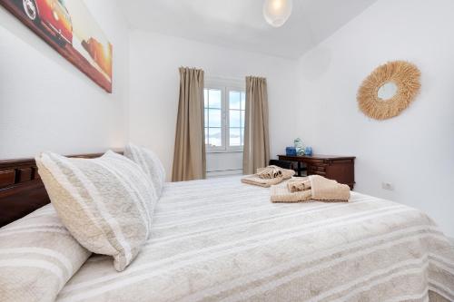 Ένα ή περισσότερα κρεβάτια σε δωμάτιο στο Casa Hespi-view to Famara Beach