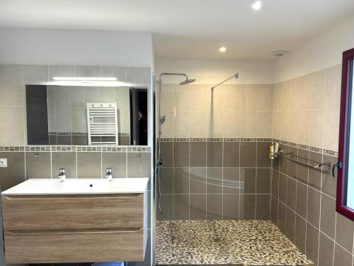 a bathroom with a sink and a shower at Villa Lou Bercail HOURTIN - 10 personnes in Hourtin