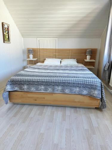 a bedroom with a large bed in a room at Centralt och havsnära på Stensö in Kalmar
