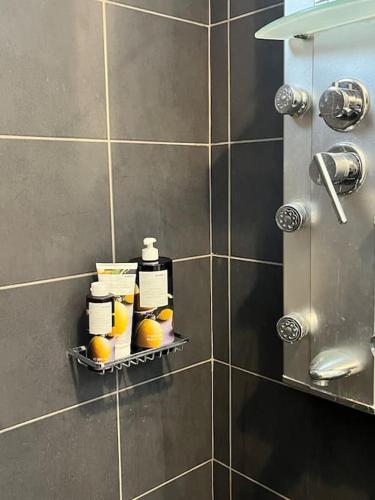 a bathroom with a shelf with oranges on it at Colibri seafront villa with pool in Nopíyia