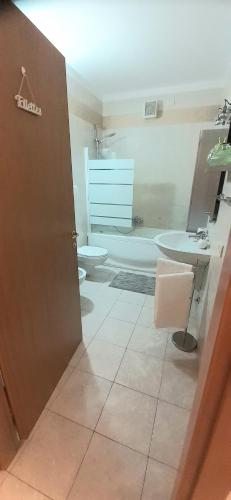 a bathroom with a toilet and a sink at Casa Olimpia 52 in Verona