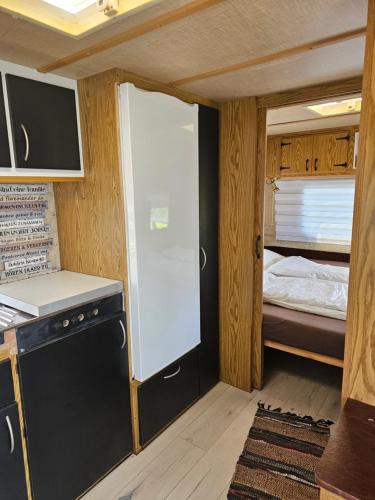 Кровать или кровати в номере Beachfront Caravans