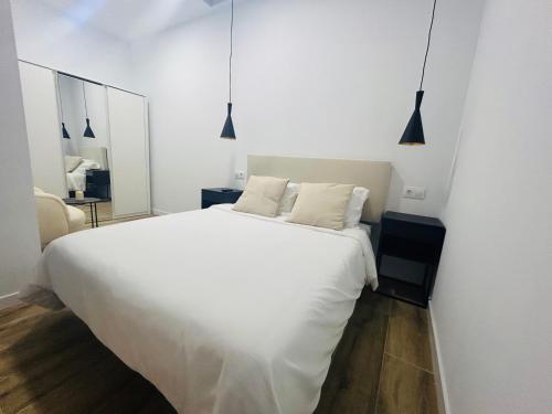 Ένα ή περισσότερα κρεβάτια σε δωμάτιο στο Apartamento en Camariñas