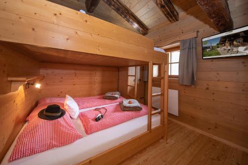 Cama o camas de una habitación en Almhütten Saalbach-Hinterglemm