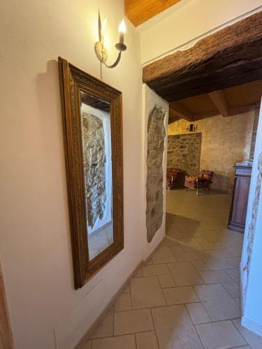 a picture hanging on a wall in a hallway at Il Borgo & il Feudo in Badolato