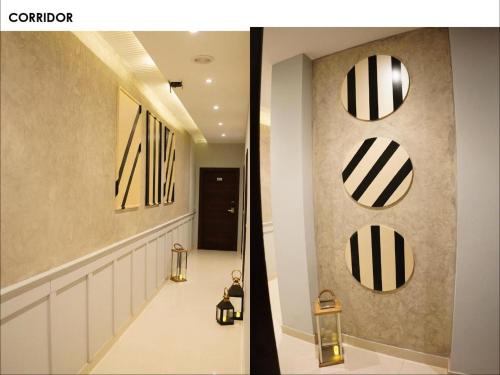 a hallway with black and white mirrors on the wall at Narison by Divud Ecom in Amritsar