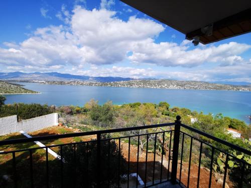 a view of a lake from a balcony at Ferienhaus Sunshine in der nähe vom Meer, free Parking, Spacious in Áyios Yeóryios