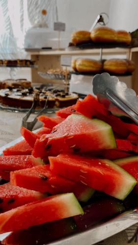 a pile of sliced fruit on a table at Due Gemelle in Rimini