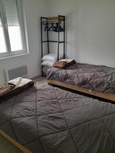 Cama o camas de una habitación en Gite les sapins