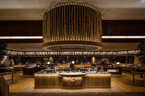 a large chandelier hanging from the ceiling of a restaurant at Kiki Shiretoko Natural Resort in Shari