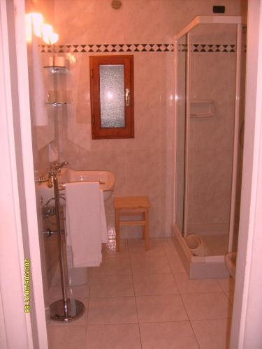 a bathroom with a shower and a toilet and a sink at La Fattoressa in Florence
