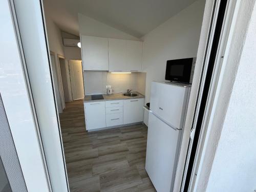 O bucătărie sau chicinetă la Jakovljevic apartman