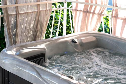a hot tub with water in the middle at Apartments Anita Frane in Vodice